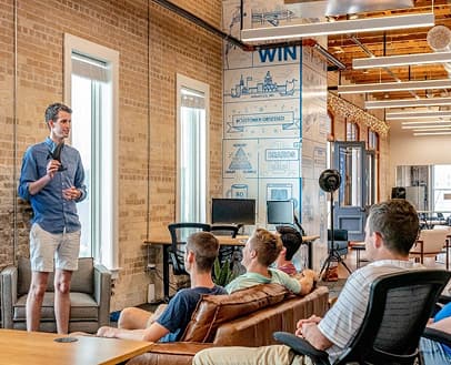 Person taking a presentation in front of people