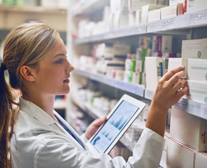 Pharmacist checking medicines